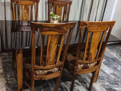 Wood dining table with heavy glass